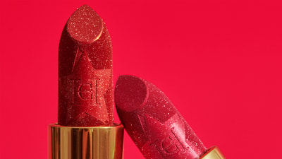 The Lipstick Glitz Shade in a pink background