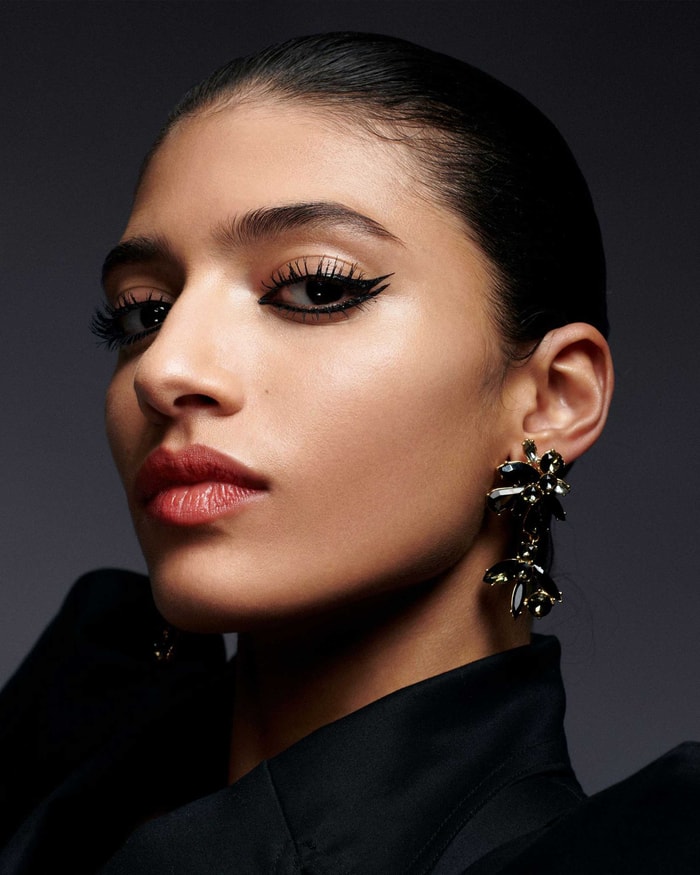 Model with eyeliner products