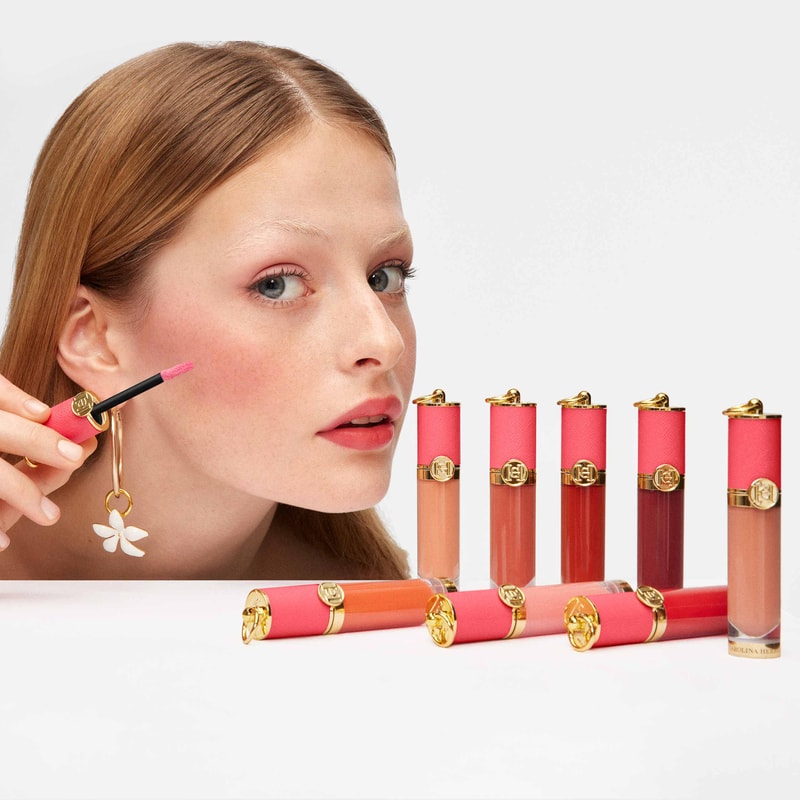 Model putting liquid blush on her face