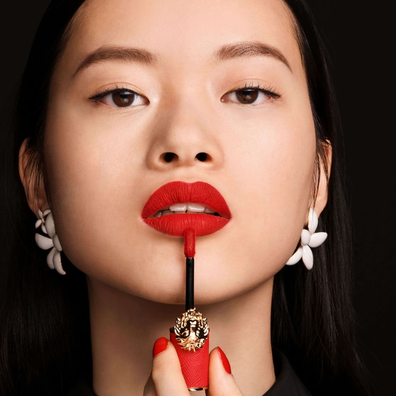 Model using liquid lipstick velvet